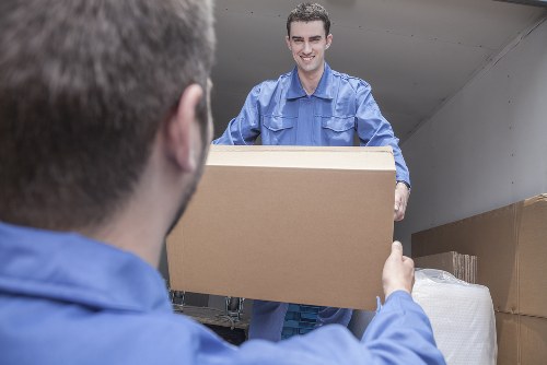 Local movers preparing furniture for a home move in Northwood