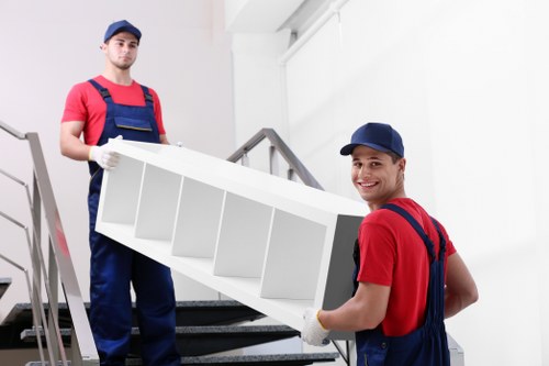 Careful loading and handling of household items into a van