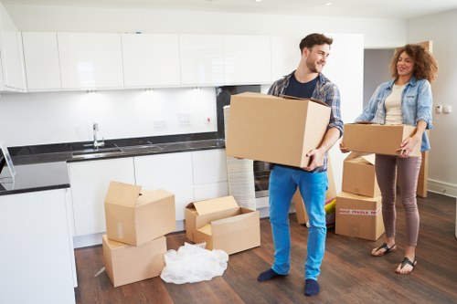 Professional movers loading furniture for a Northwood home move