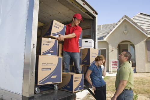 Local moving van handling furniture and boxes in Northwood