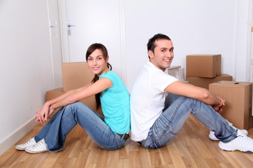 Local removals crew unloading boxes at a Northwood home