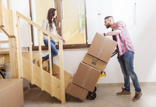 Professional movers loading furniture for transport